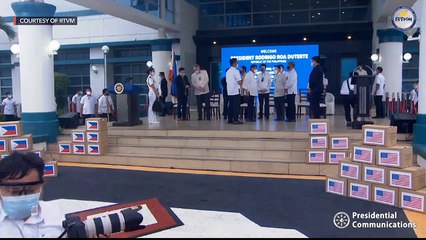 President Duterte and government officials welcome the arrival of Moderna vaccines from the US