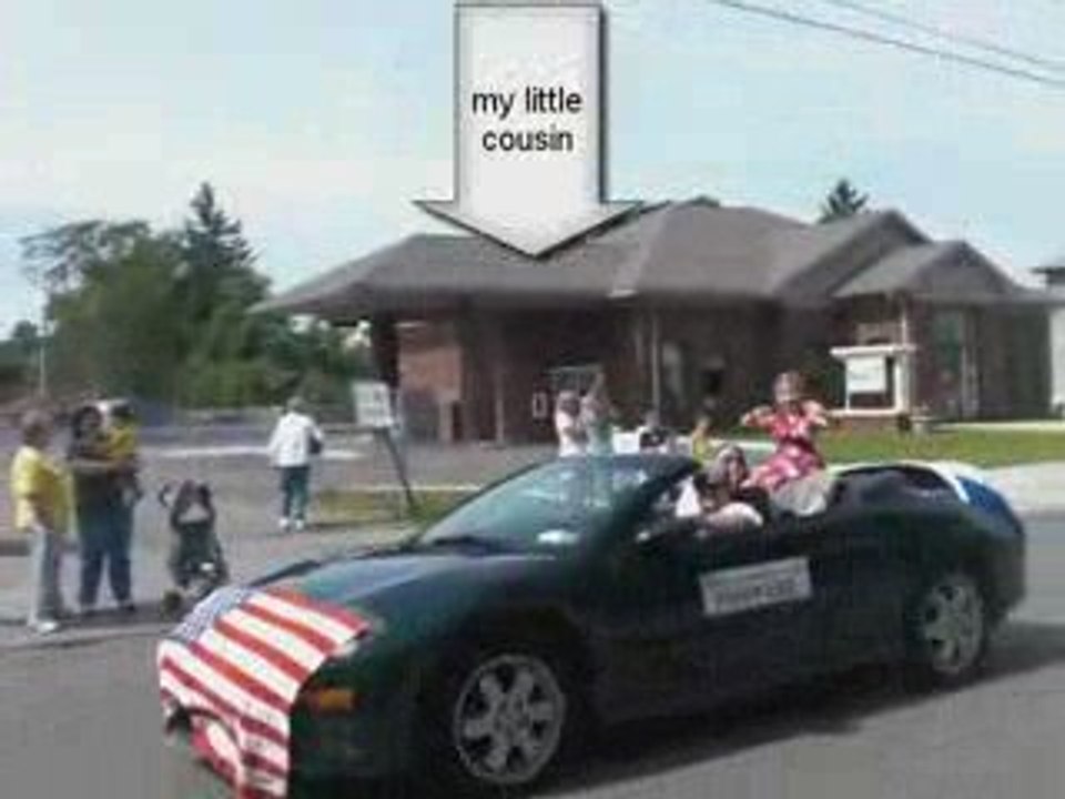 Chris Hughes rides the Unicycle in a Parade