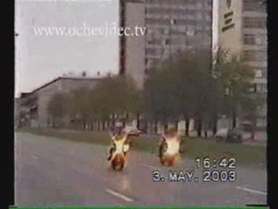 motorcycle crashes into cop car