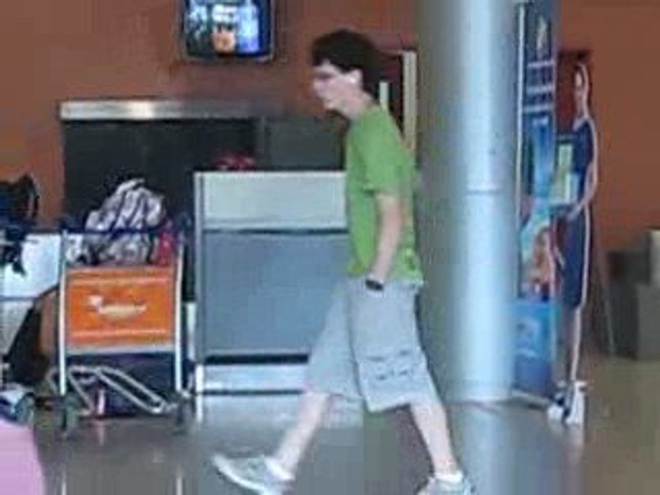 Mathieu killing time with his iPod in Phenom Phen airport