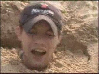 Friend buried at the beach and tickled