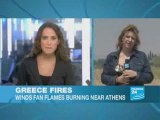 Thousands flee their homes as wildfires rage near Athens