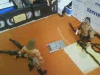Paul burchil vs undertaker figurine de catch