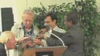 World Peace Delegates remove Sword from Sword Swallower