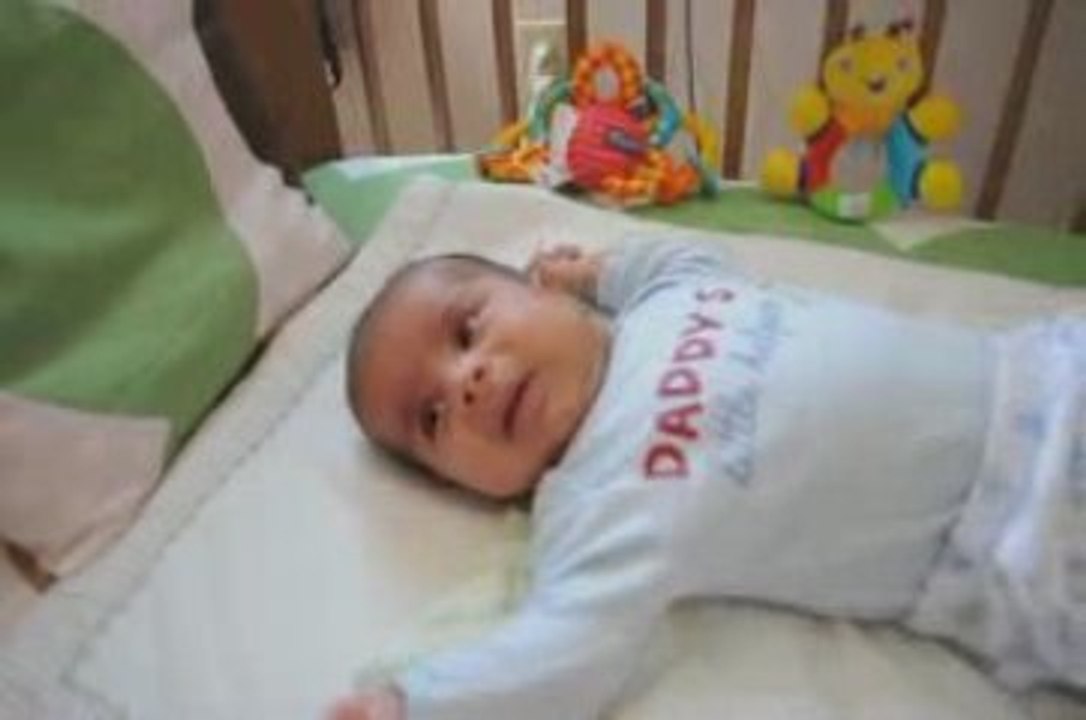 Playing in Crib