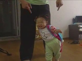 Baby Mideum playing peekaboo with Daddy's legs