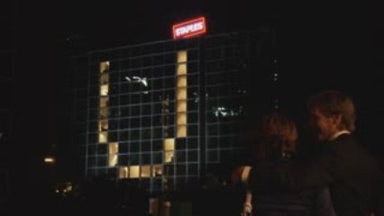 Guy puts text message on office building
