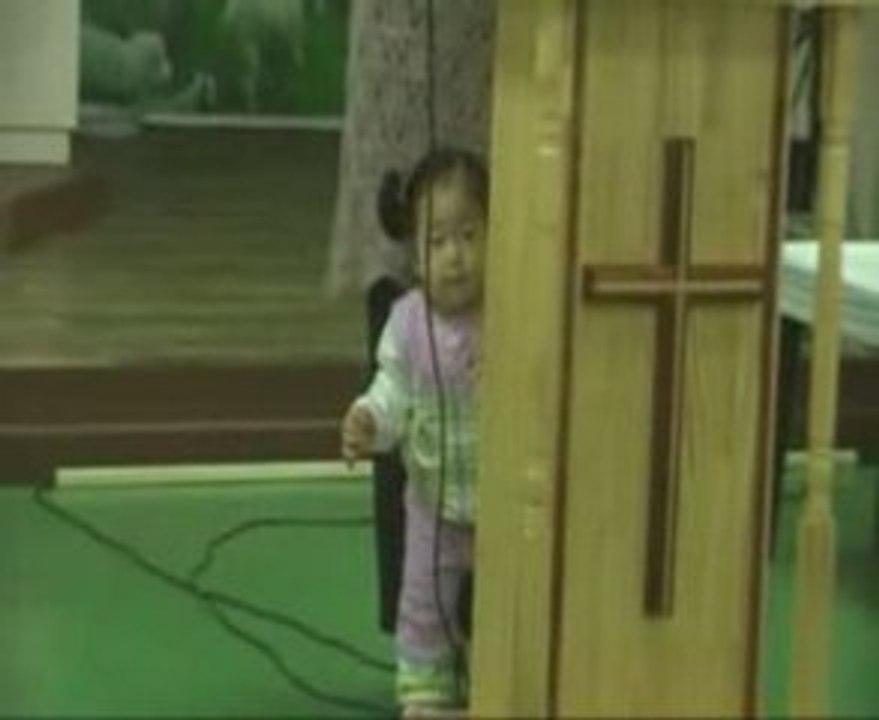 Baby Mideum playing in church