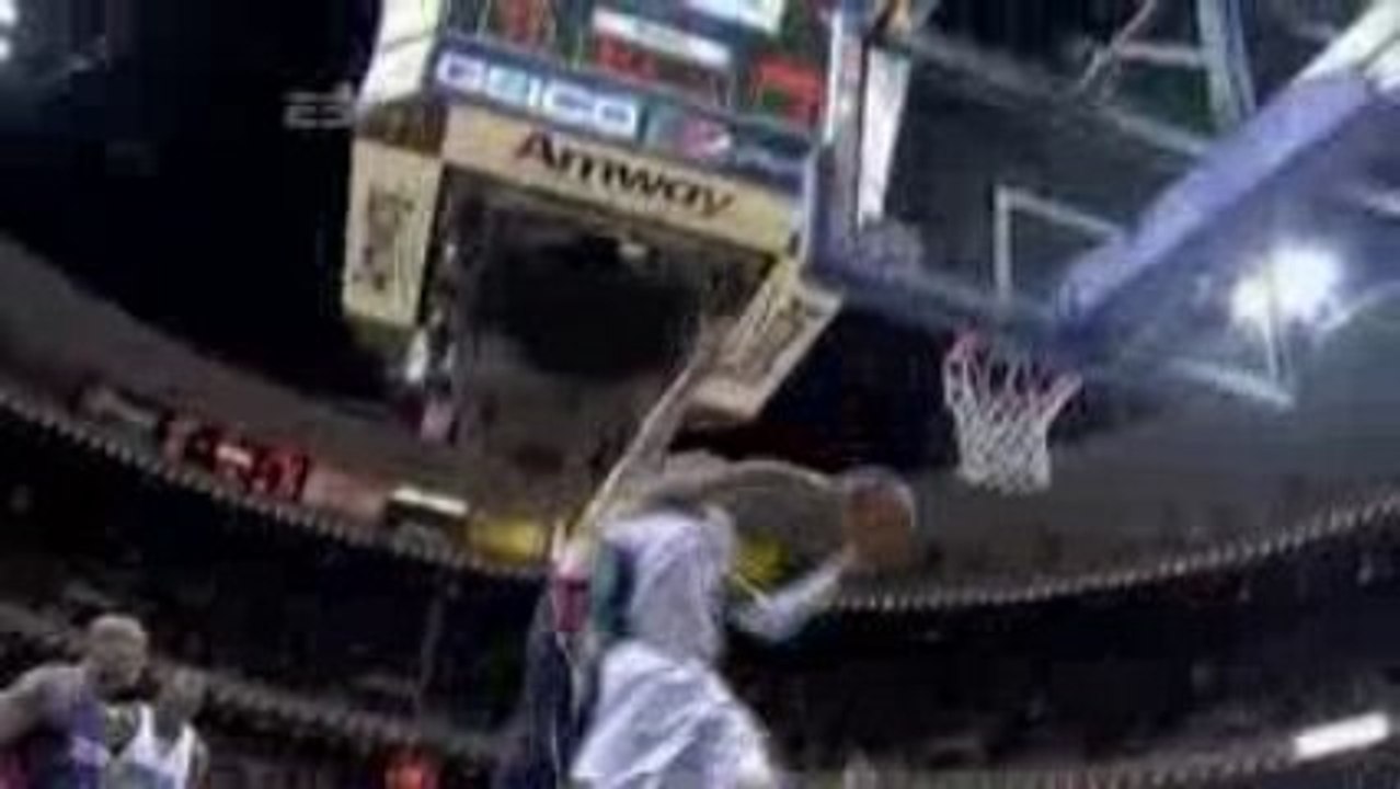 Vince Carter elevates for the two-hand dunk.