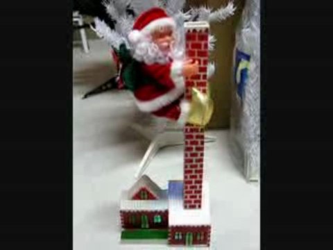 pere noel automates maisonnette monte et descend de sa chemi