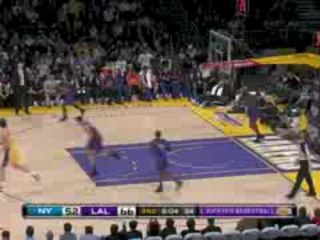 NBA Kobe Bryant steps through the defense and lays it in for