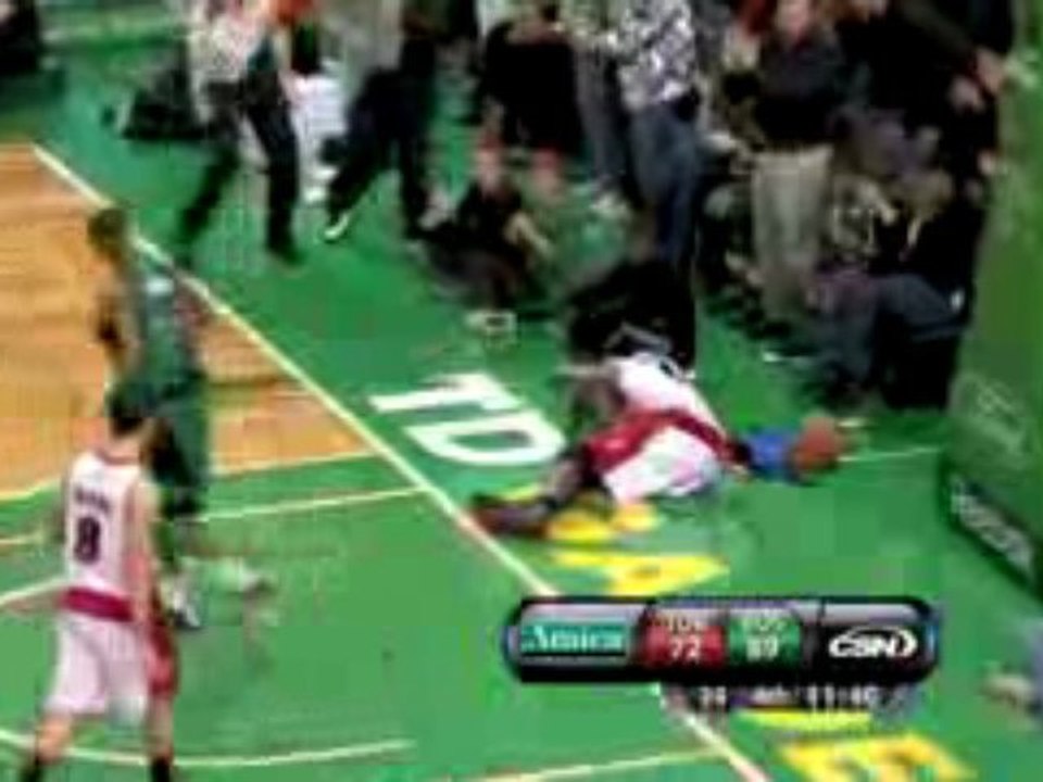 NBA Paul Pierce throws down a powerful dunk against a defens