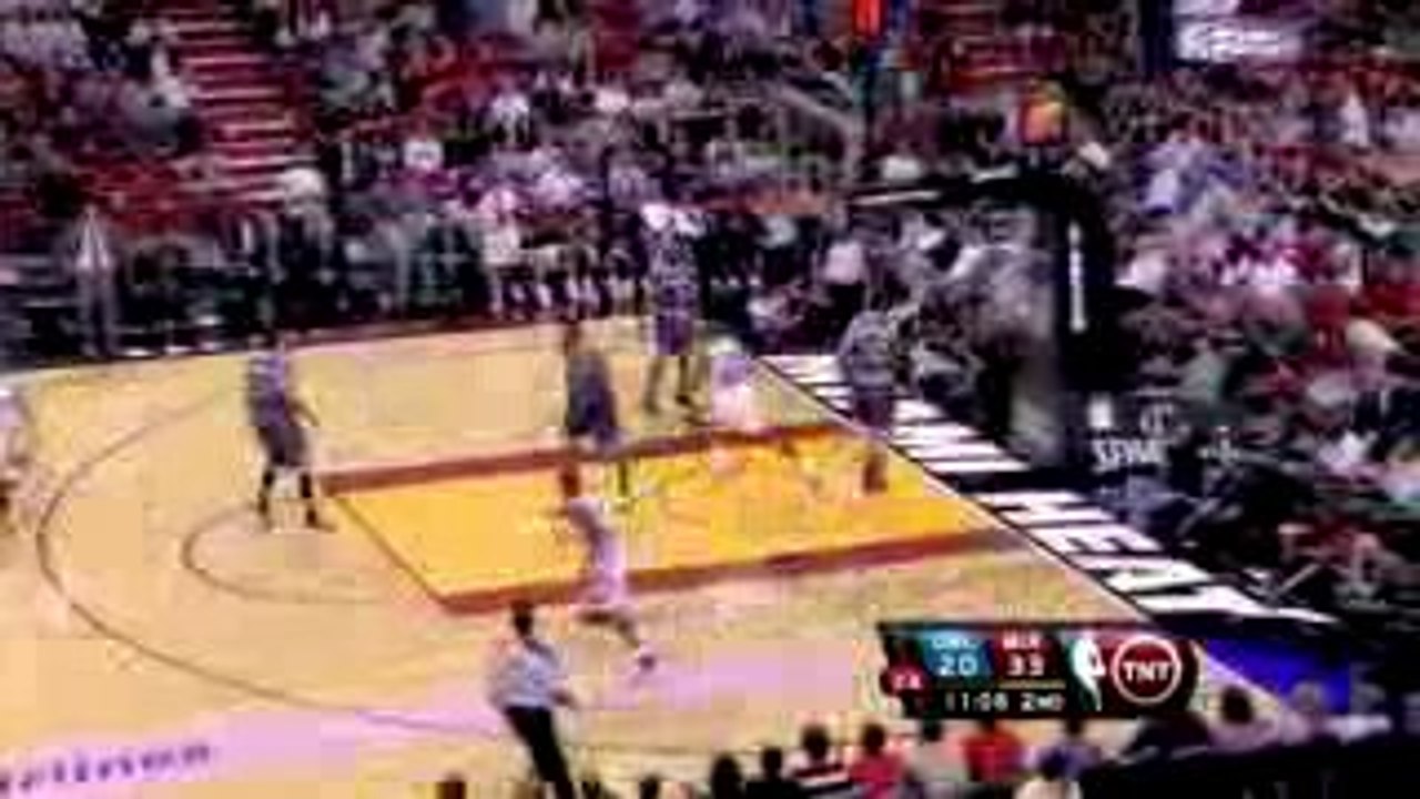 NBA Mario Chalmers squeezes a pass to Joel Anth...