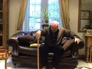 oldman trying to get up from the sofa