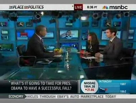 Un homme armé attend Obama lors d'un meeting