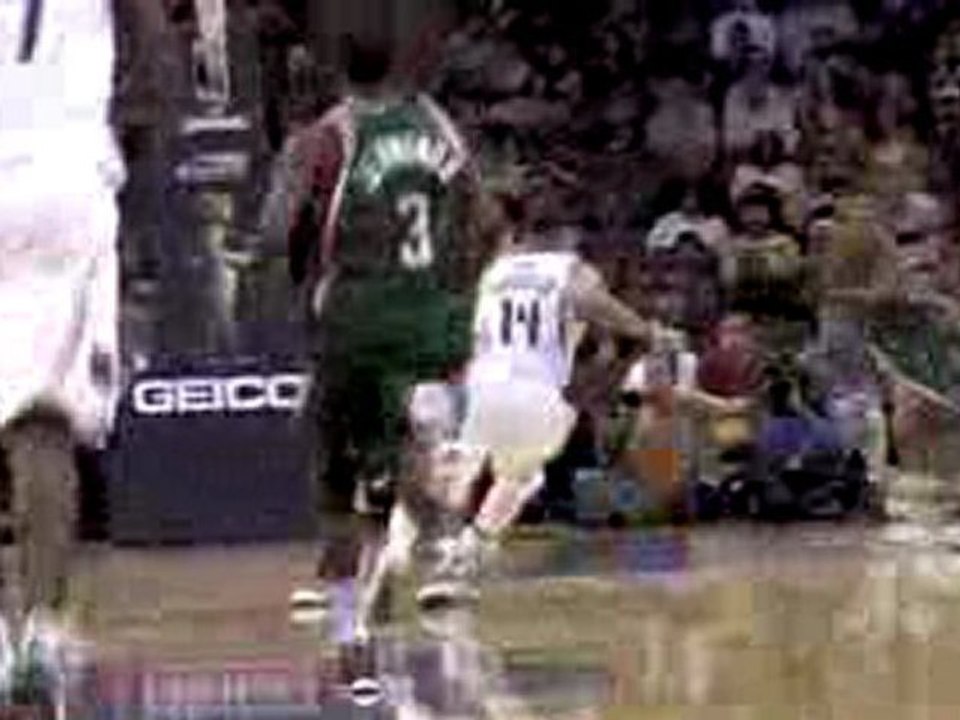 NBA Andrew Bogut swats D.J Augustin's shot into the stands.