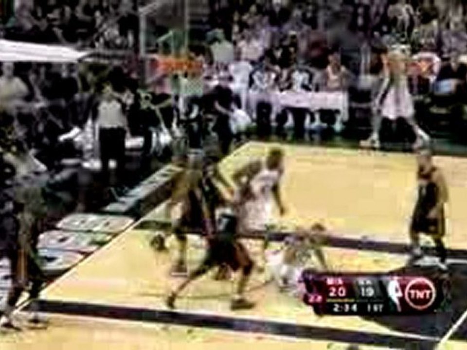 NBA Tim Duncan throws a nice pass to rookie DeJuan Blair, wh