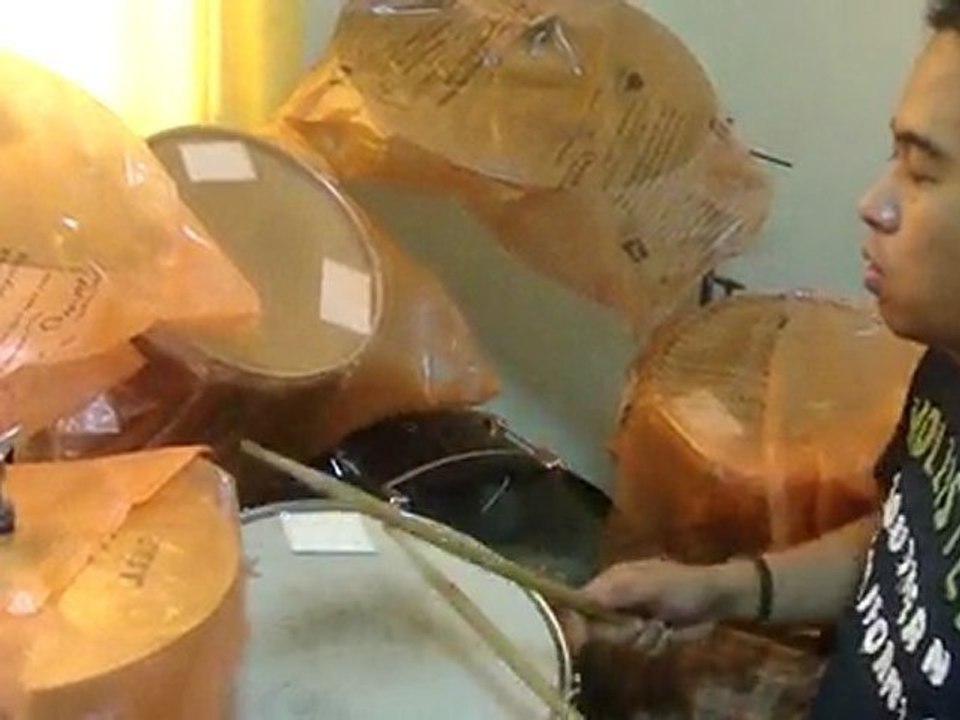 Chris Veloso playing drums ( Moonpools and Catterpillars )