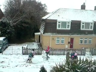 children building a snowman in newton abbot