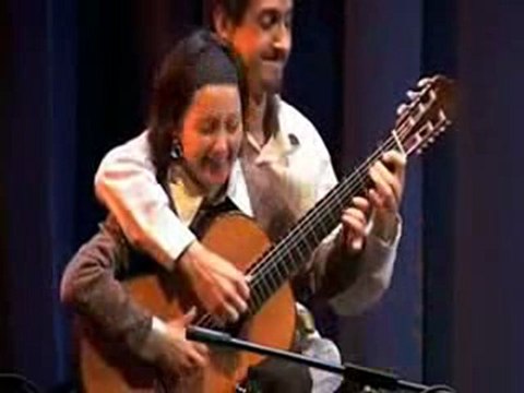 Guitare a quatre mains