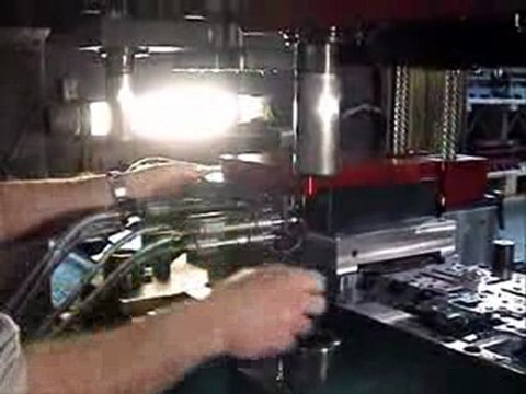 Pronic tapping unit for door latches components