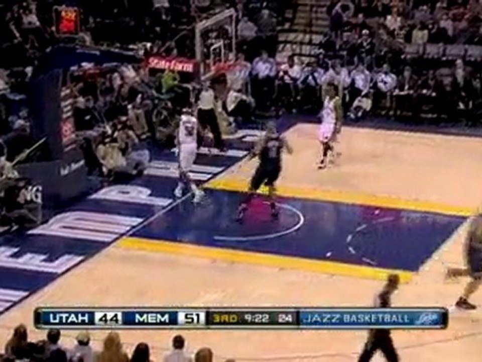 NBA Carlos Boozer rocks the rim with a two-handed jam.