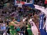 LeBron James drives to the basket but Kyle Korver blocks his