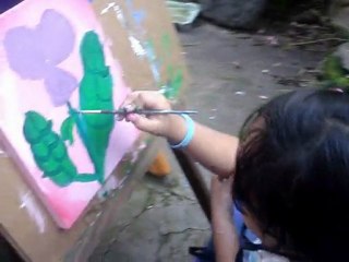 Daniela y Marito pintando con el corazon