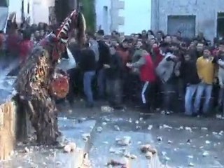 Man in Devil Costume being pelted by turnips - Jarramblas