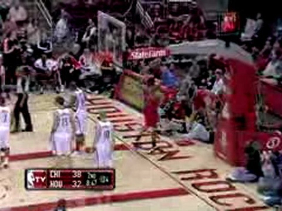 Brad Miller stumbles out of bounds and runs over a cameraman