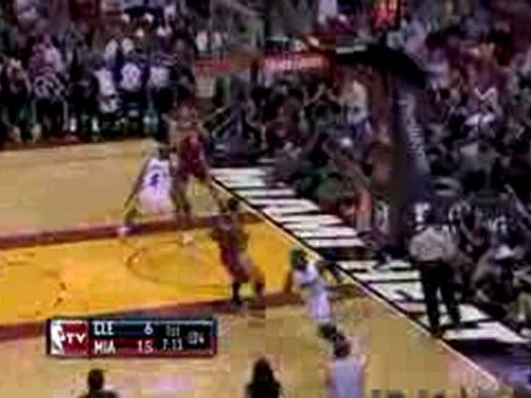 Dwyane Wade picks up the errant pass and throws down a dunk