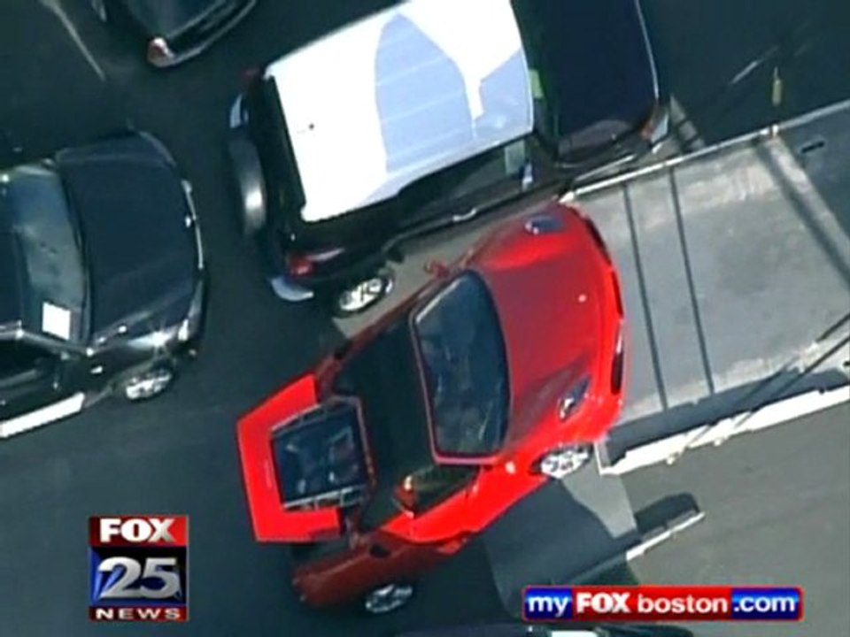 Crash - Ferrari takes fall off delivery tuck