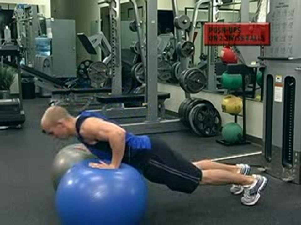 Push up on two exercise balls