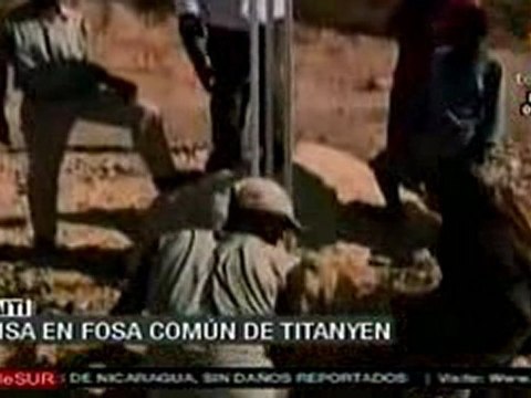 Haitianos realizan misa en fosas comunes