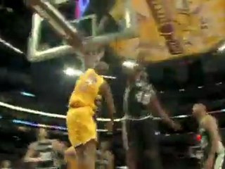 Lamar Odom uses his speed to get by Tim Duncan for the basel