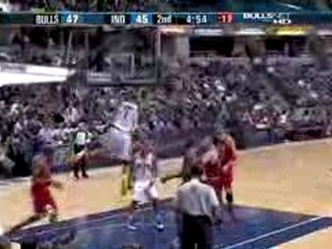 Dahntay Jones gets to the paint, does a spin and finishes wi