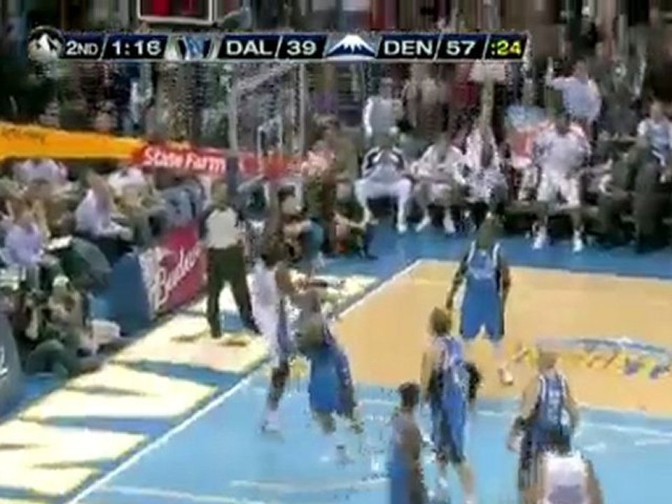 Nenê grabs the rebound off of the missed shot and puts it ba