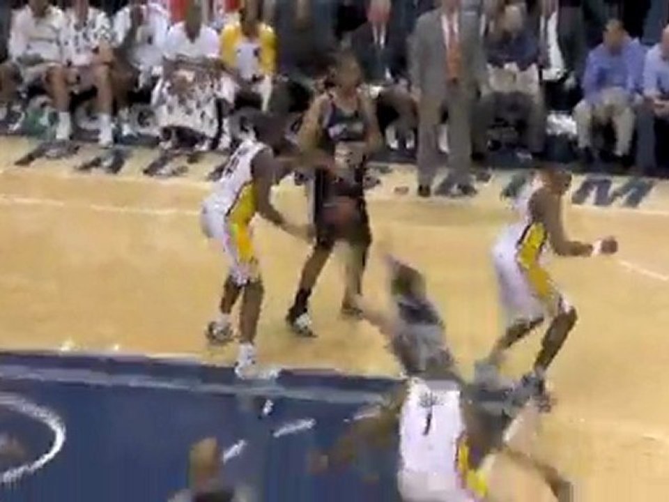 Tim Duncan finds a cutting Manu Ginobili in the lane for the