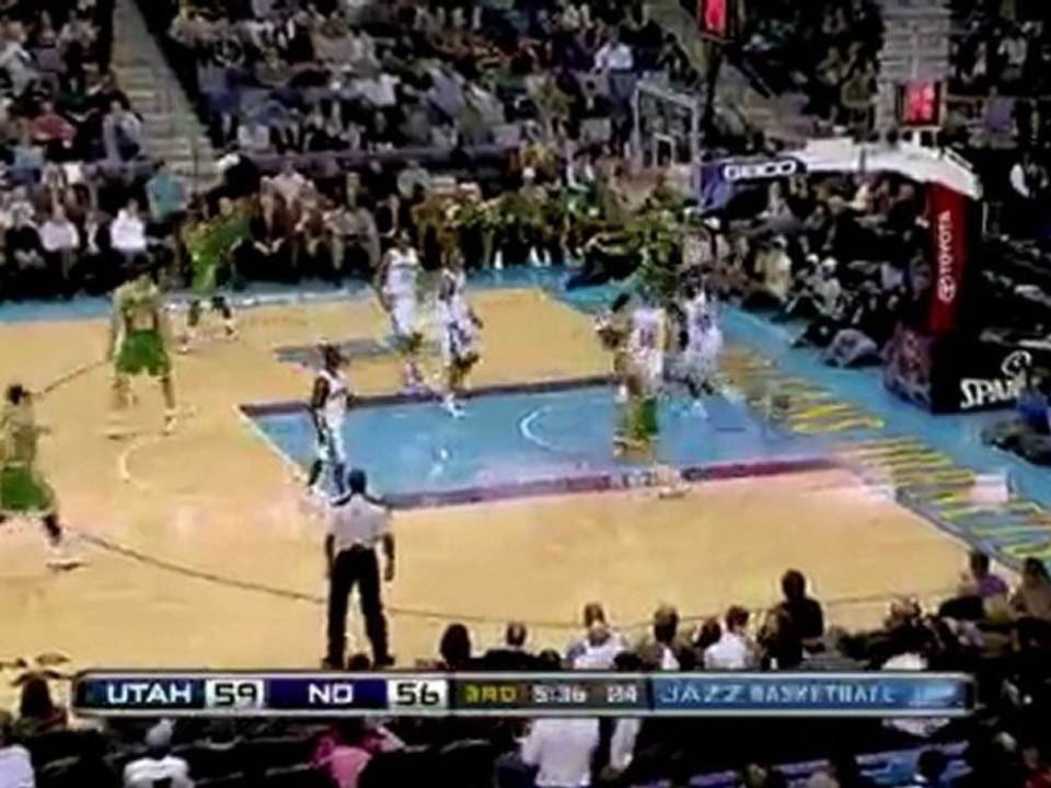 Carlos Boozer delivers a facial with a two-handed jam over E