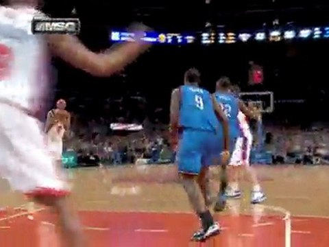 Jonathan Bender finds Tracy McGrady under the bucket for the