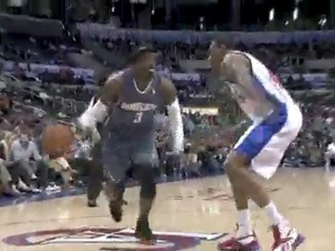 Gerald Wallacs spins into the lane and the shot finds the ho