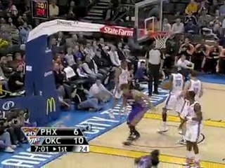 Goran Dragic hangs in the air and throws up a shot that find