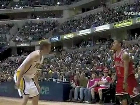 Derrick Rose drives by Troy Murphy on the baseline for the u