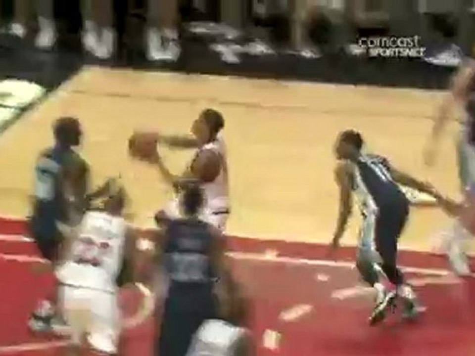 Derrick Rose power drives down the lane and takes off for th