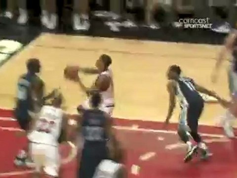 Derrick Rose power drives down the lane and takes off for th