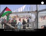 Palestinians protesting against the on-going...