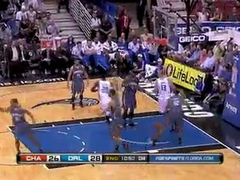 Two Magic players go up for the putback but Mickael Pietrus