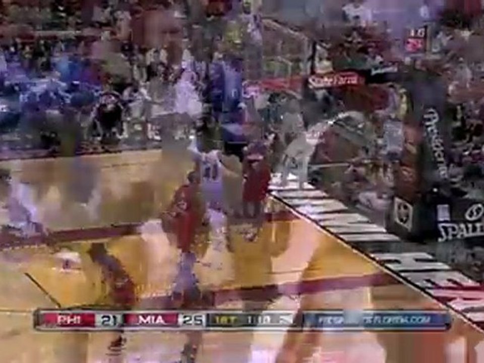 Dwyane Wade throws a behind-the-back pass to Udonis Haslem,