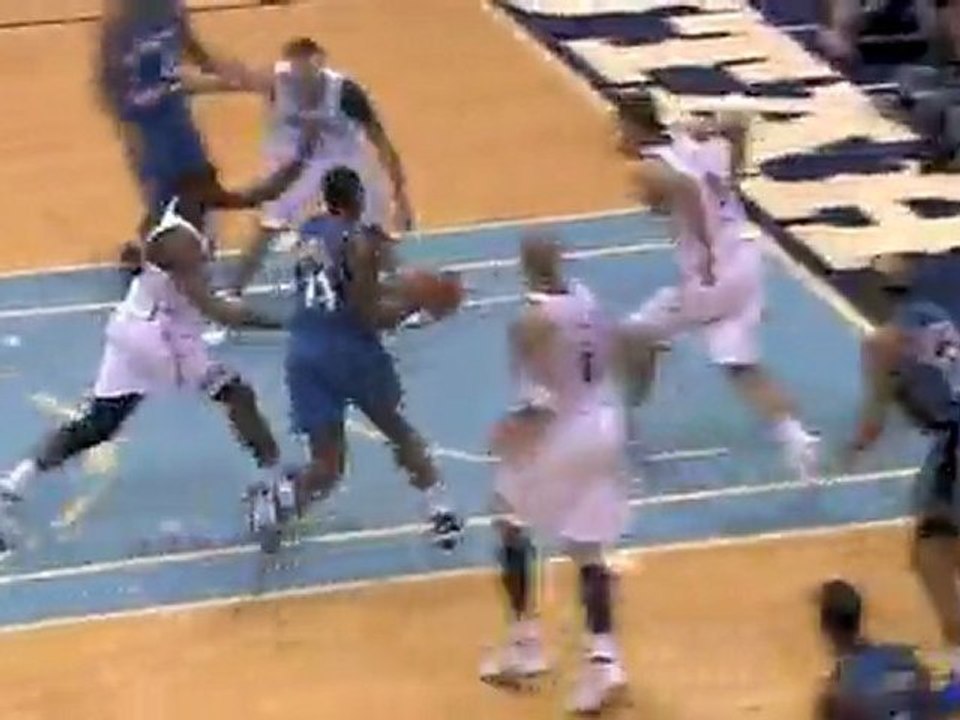 Mehmet Okur blocks the ball right back into play against the