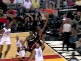 Dwyane Wade splits a double-team on his way to the bucket an